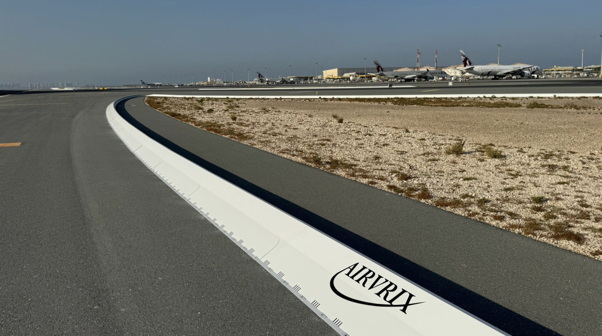 Commercial airport runway safety system with collapsible FOD barrier preventing aircraft engine damage