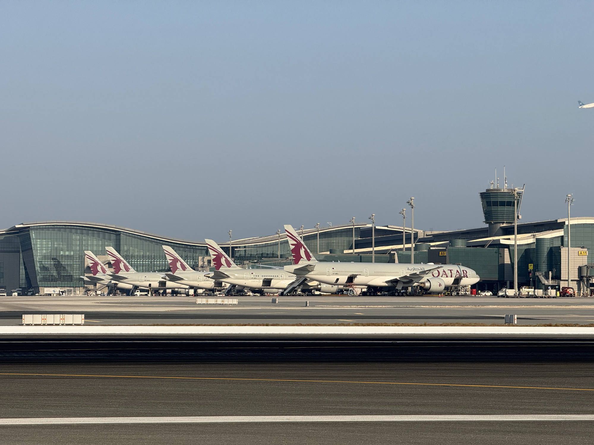 Commercial airport runway safety system with collapsible FOD barrier preventing aircraft engine damage