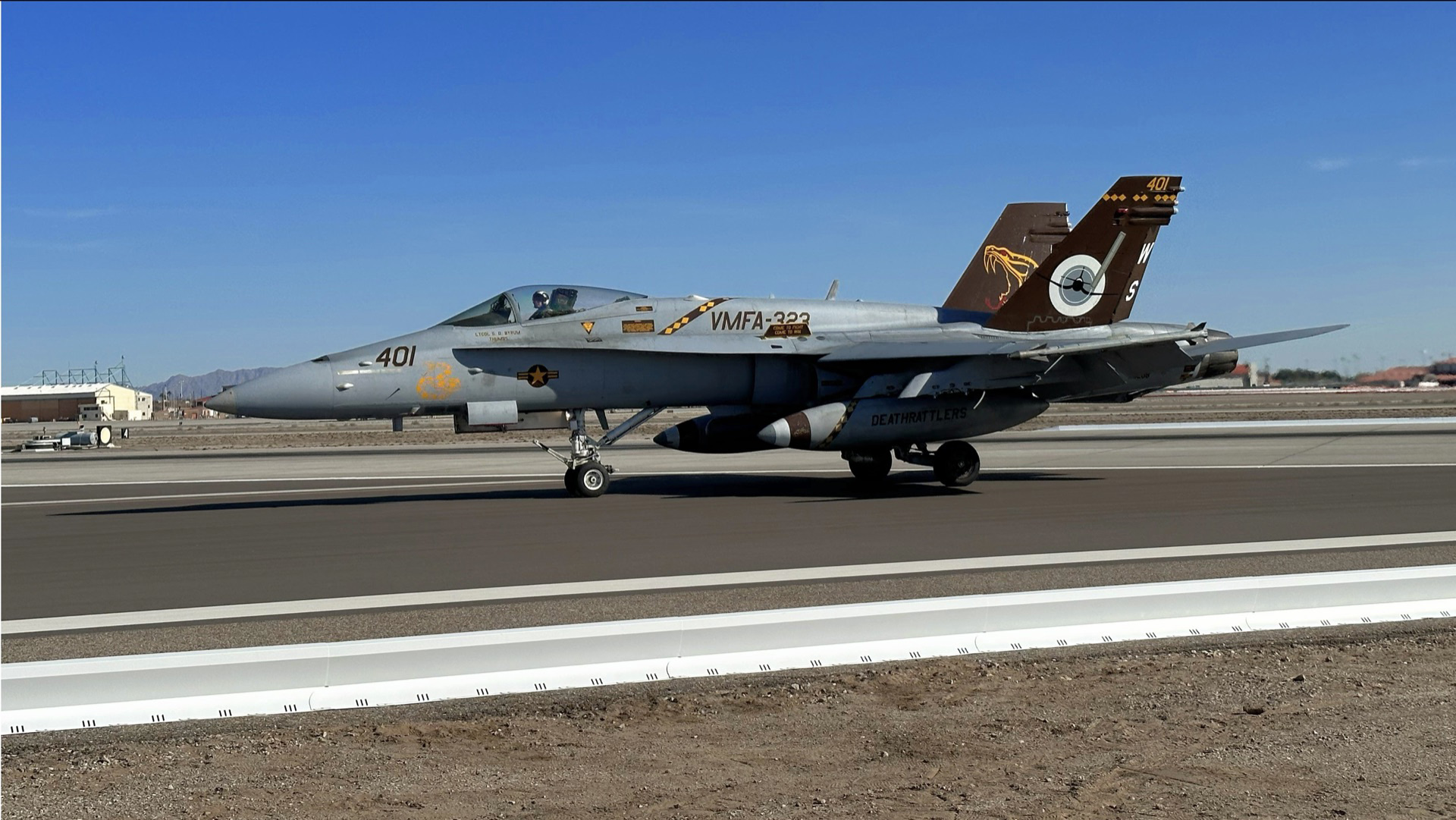 Combat airbase FOD barrier system protecting military aircraft from debris